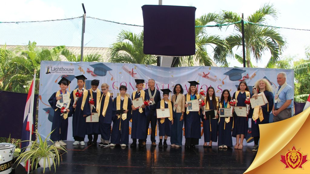 Graduates on stage with their teachers